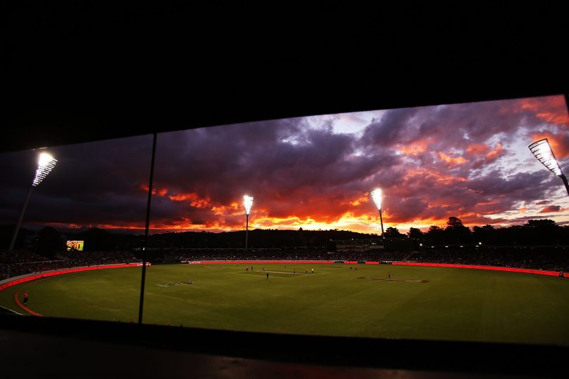 Big Bash League game being played under lights at Manuka Oval