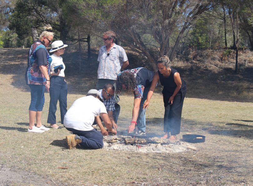 Cooking up a feast of local oysters, mussels and abolone on and open fire, NSW Governor chats with Chris Bird