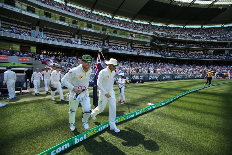 MELBOURNE, AUSTRALIA - DECEMBER 26: Michael Clarke and Brad Haddin of Australia lead their team onto the field after the tea-break during day one of the Fourth Ashes Test Match between Australia and England at Melbourne Cricket Ground on December 26, 2013 in Melbourne, Australia. (Photo by Scott Barbour/Getty Images)