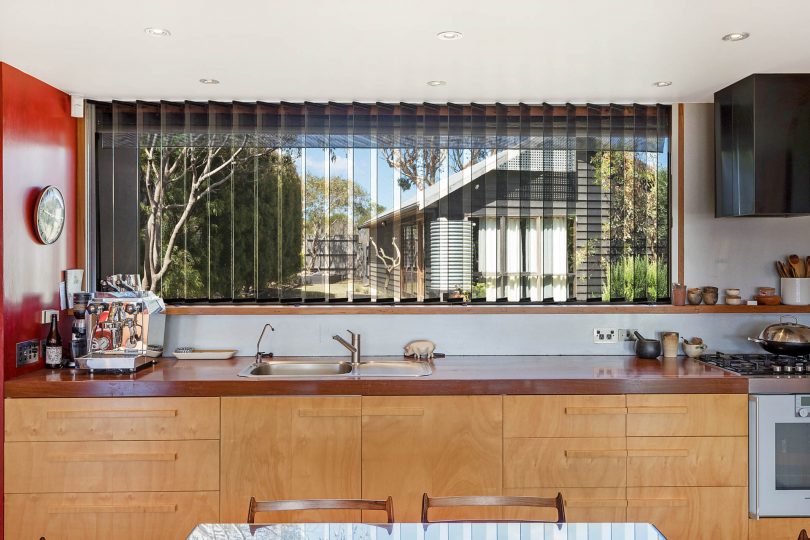 Some of this home's features are the vertical louvre glass panels of the kitchen. Photo: Supplied
