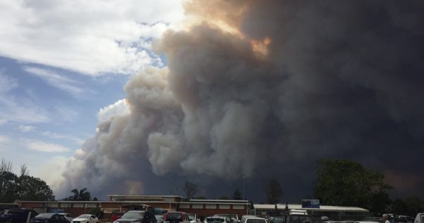 Coming together to witness and wait in the wind, watching the fires from Moruya