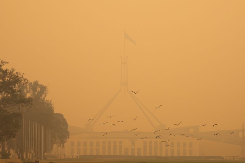 Parliament House blanketed by smoke.