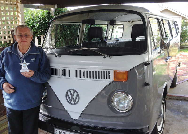 Kevin Thompson standing in front of VW Kombi.