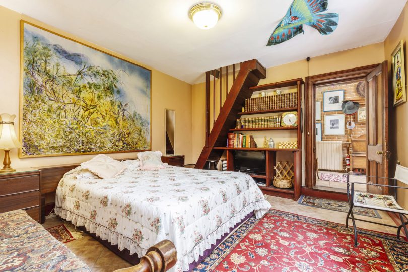 The Summer bedroom built into the original cottage kitchen, with attic loft.