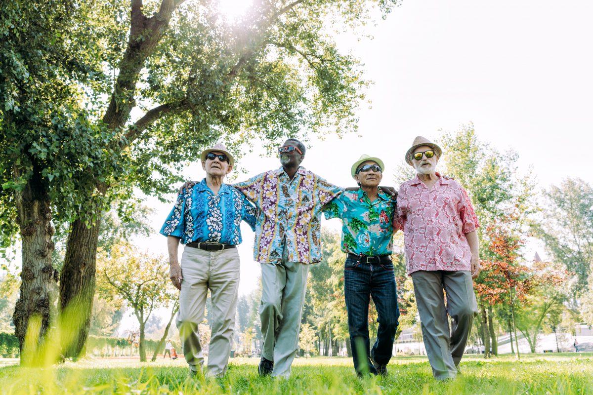 group of senior friends playing at the park