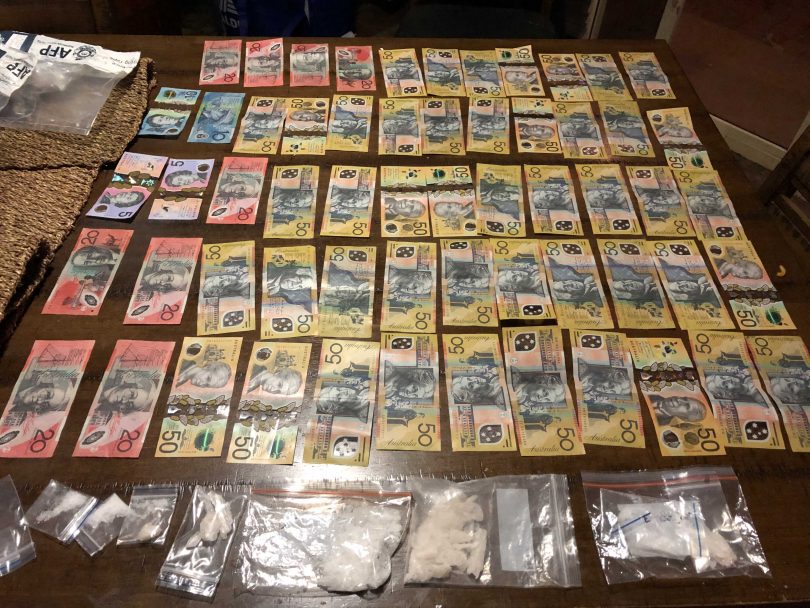 Cash and drugs seized by police 