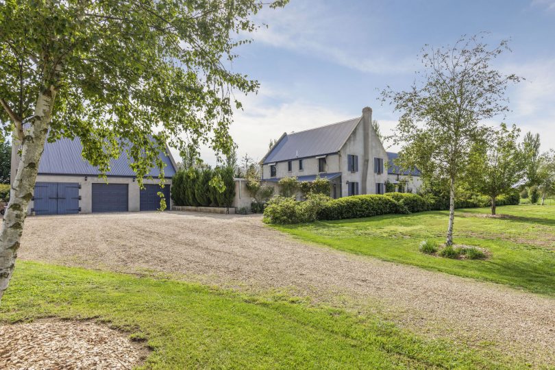 The courtyard connects garage and workshop to the house