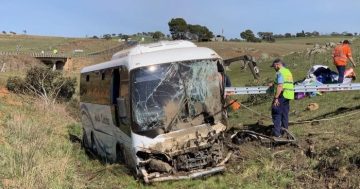 Driver charged over bus crash