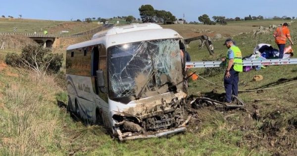 Driver charged over bus crash