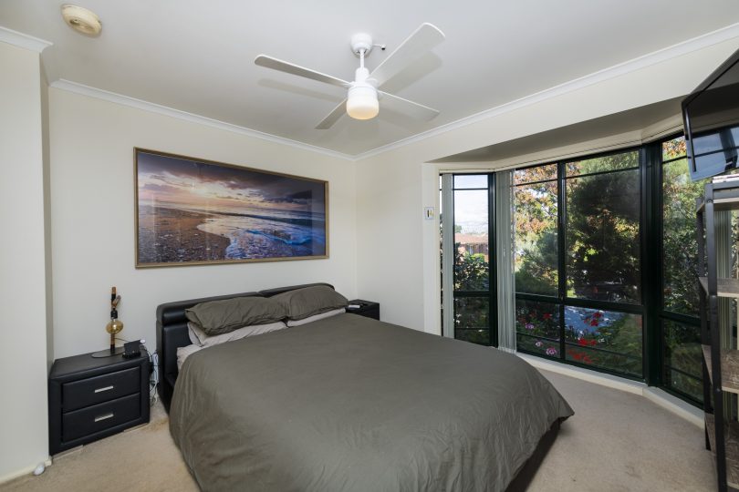 The spacious master bedroom with bay window