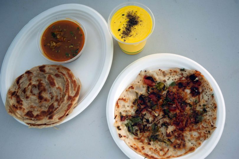 Chicken curry with parotta, mango lassi, and vegetable utthapam