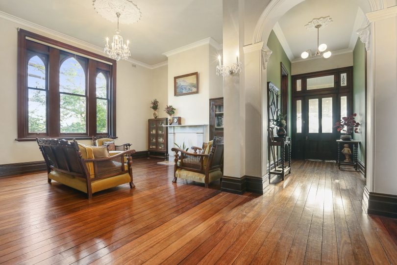 Polished hardwood floors, chandeliers and high ceilings