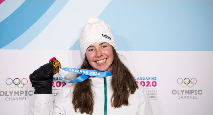 Josie Baff posing with Winter Youth Olympics gold medal.