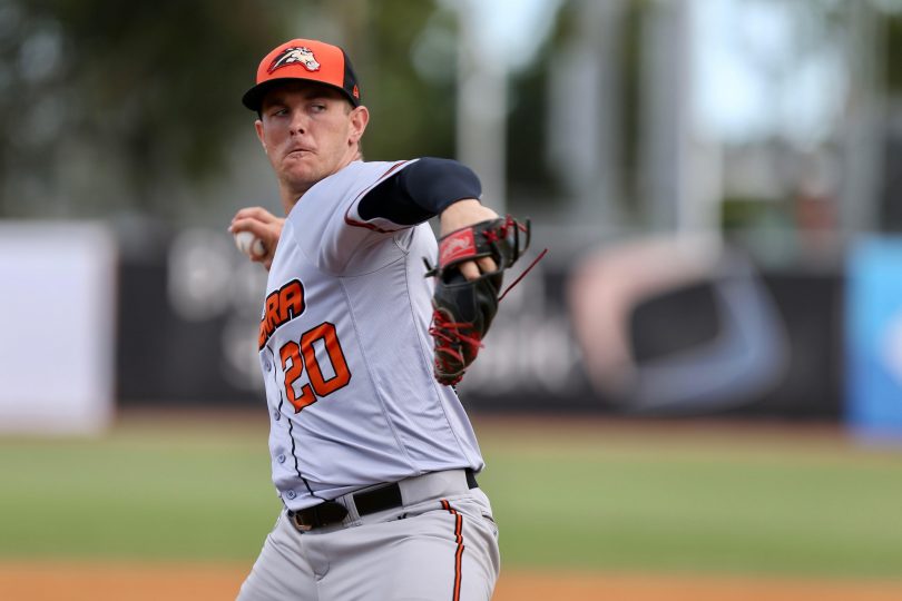 Baseballer Josh Warner pitching for Canberra Cavalry.