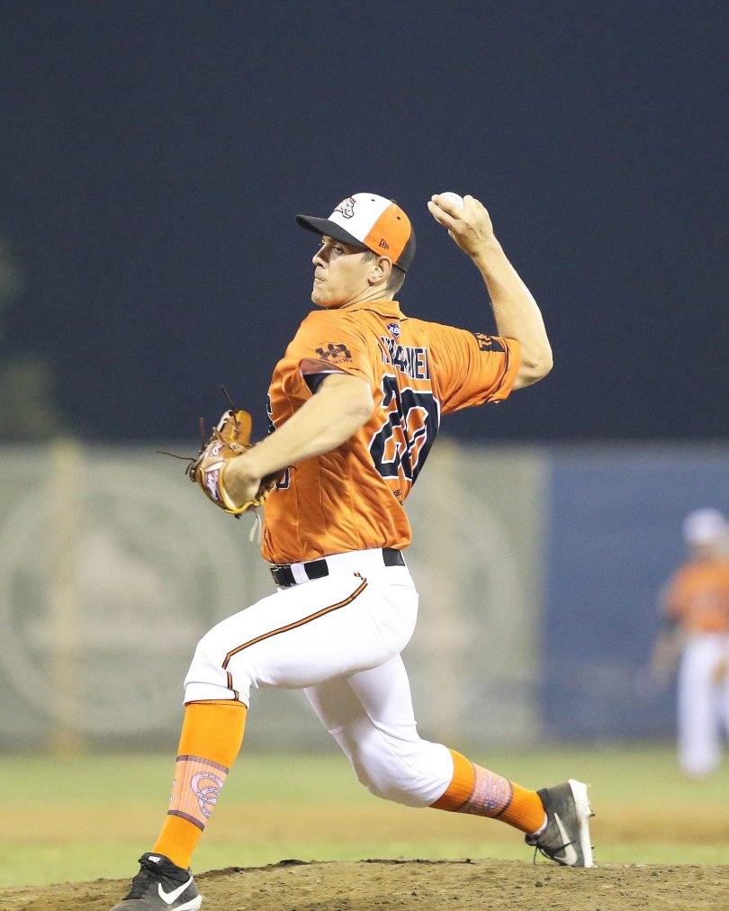 Baseballer Josh Warner pitching for Canberra Cavalry.