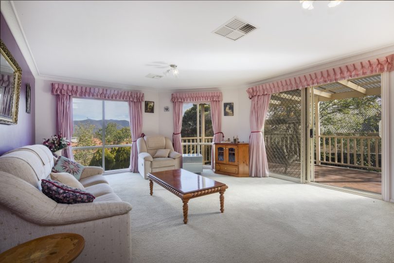 The living room has stunning wrap-around views of the Brindabellas.