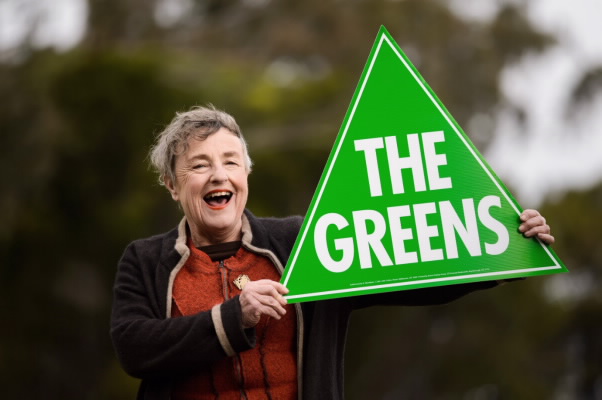 Deb Foskey with Greens sign