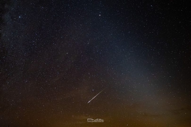 The meteor shower is captured shooting its way among the stars as seen from Lake George.