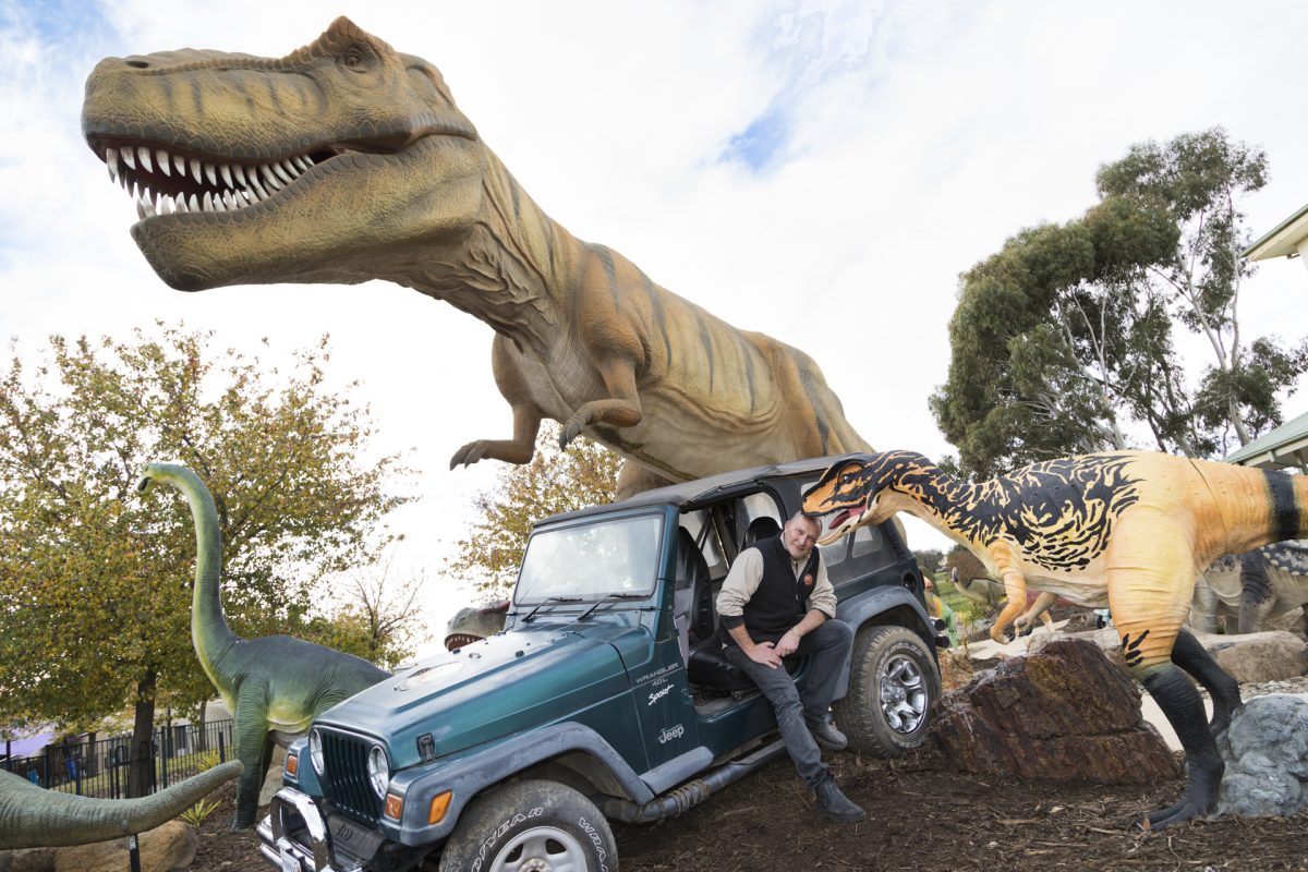 dinosaur and car