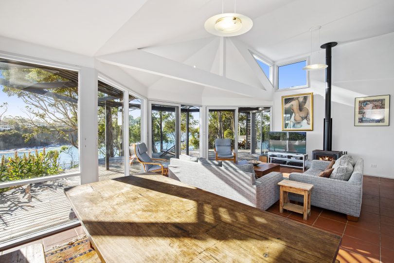 Floor-to-ceiling glass takes full advantage of the ocean views