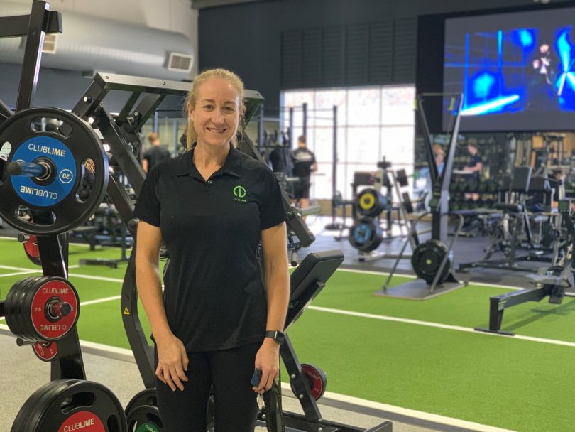 Emma Stockbridge standing in Club Lime gym.