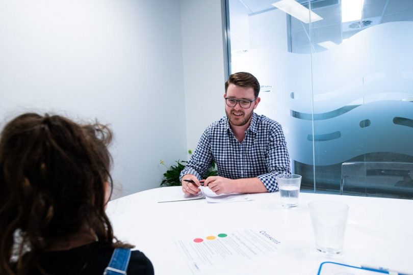 Conflict Resolution Service Family Support Program manager Hamish Guthrie in office with client.