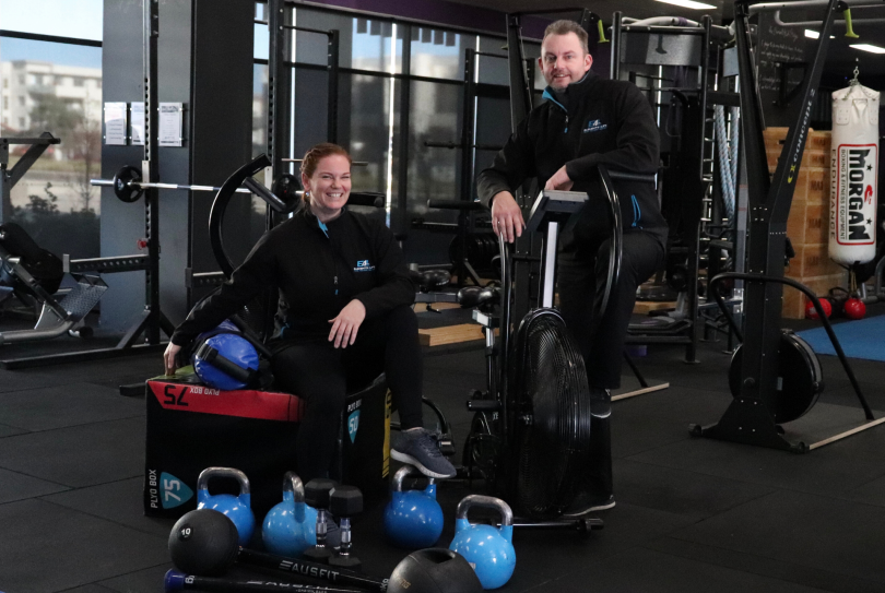 Erin Wells (left) and Sebastian Ellis (right) standing in Elements4Life gym.