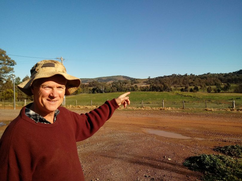 Paul Carmody standing on rural property.