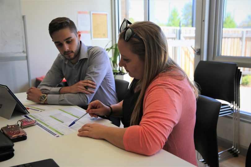 Members of Communities@Work's Youth Advisory Board writing its Sustainability Action Plan.