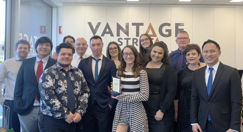 The Vantage Strata team posing with the Strata Community Association's award for Strata Community Management Medium Business of the Year.