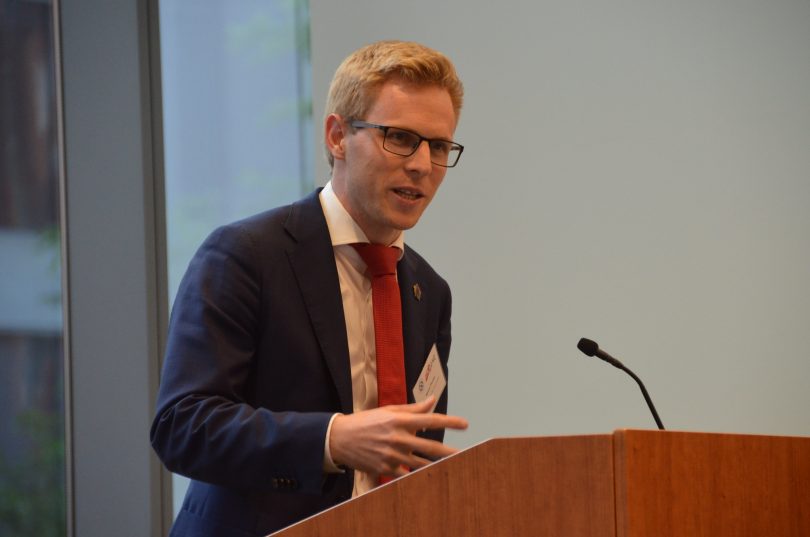 Kieran Pender speaks at a podium