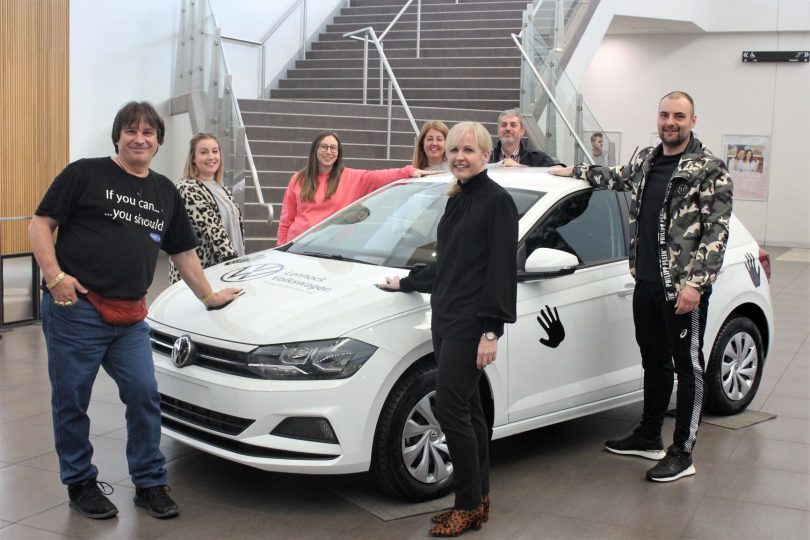 Tiny Sregic, left, with organisers and sponsors of Tiny's car challenge