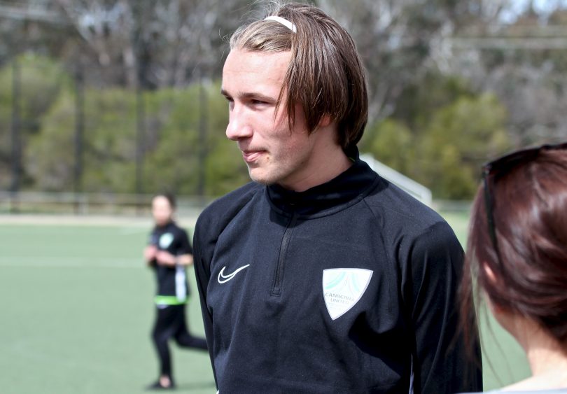 Canberra United All Abilities Academy player Luc Launder on football pitch.