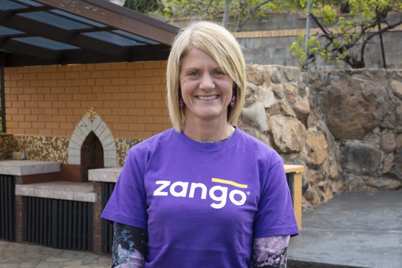 Home.byHolly principal Holly Komorowski wearing purple Zango shirt.