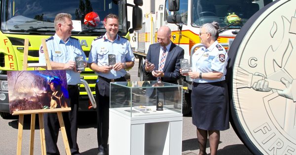 Commemorative $2 coin rolls into funds for firefighters