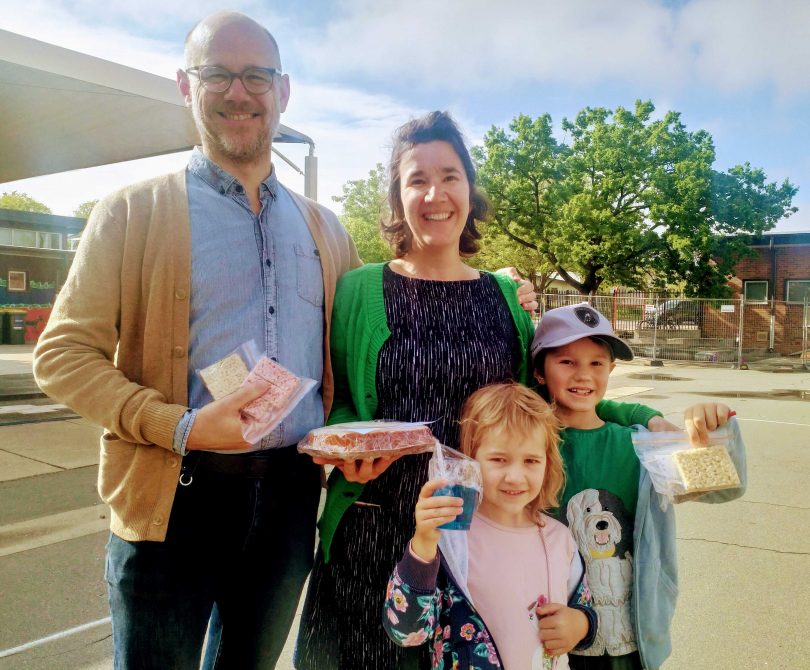 Nathan Thomas and Tabitha Carvan with their children Teddy and Dulcie at the North Ainslie Primary School polling station. 