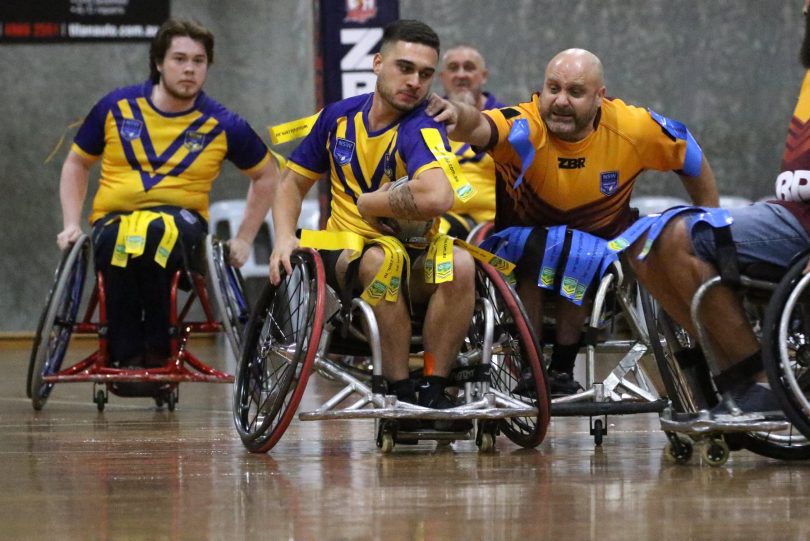 Wheelchair rugby league players in action. 