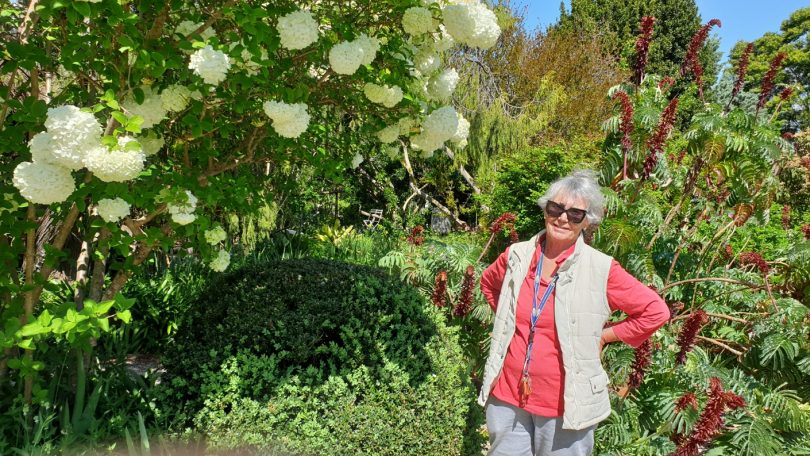 Ros Loftus standing in garden at Riversdale.