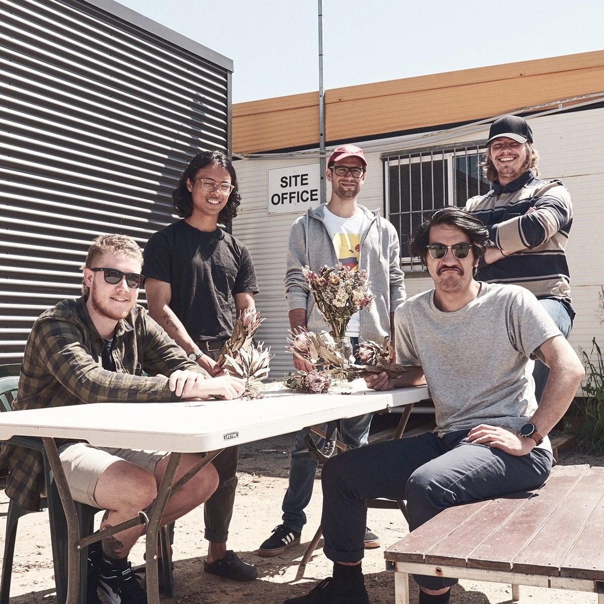 Five men around a table