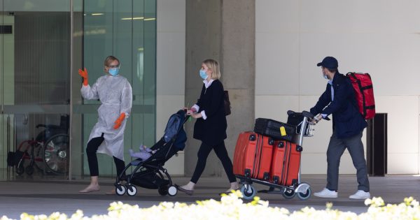 Three repatriated Australians display COVID-19 symptoms after landing