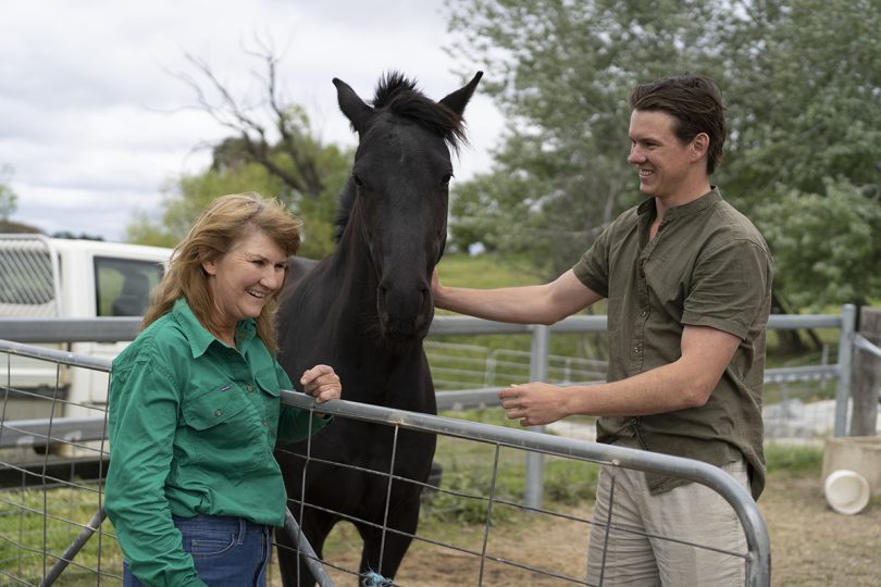 Woman and man with a horse