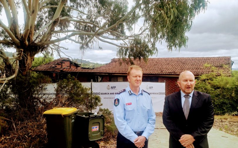 Superintendent Paul Flynn and Detective Inspector Matt Reynolds at the scene of the fatal house fire in Kambah.