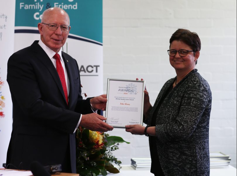 Jodie Klaus receiving her Mental Health Carer Award from Governor-General David Hurley.