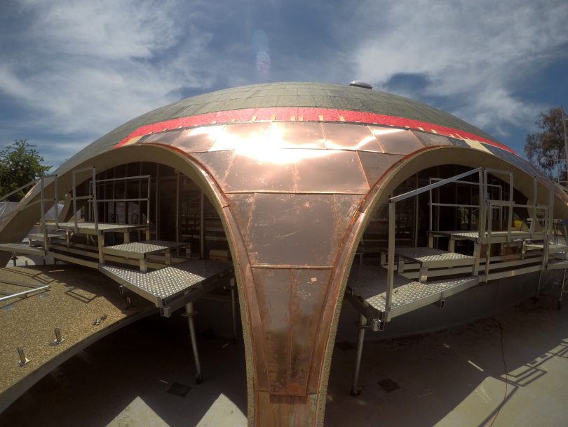 New copper tiles on one of the arches of the Shine Dome