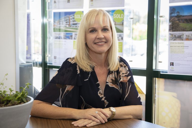 Kellie Chalker-Hall sitting in office at McIntyre Property.