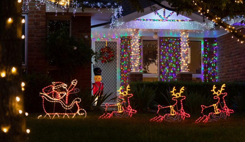 house adorned with Christmas lights