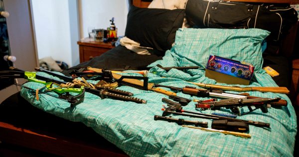 Police seize guns, cars, cash, bikes and drugs after raids on five houses