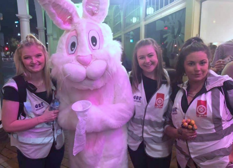 Three St John Ambulance volunteers with the easter bunny