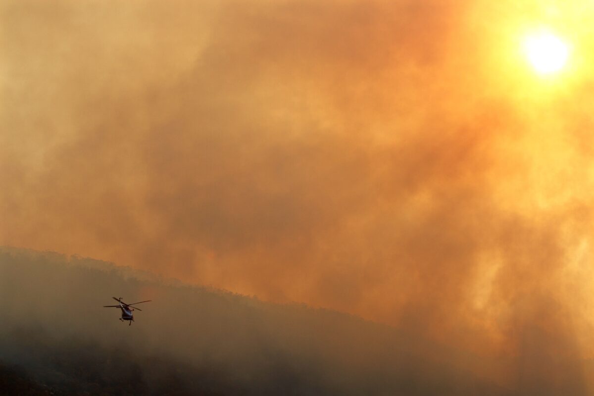 A water-bombing helicopter at bushfire