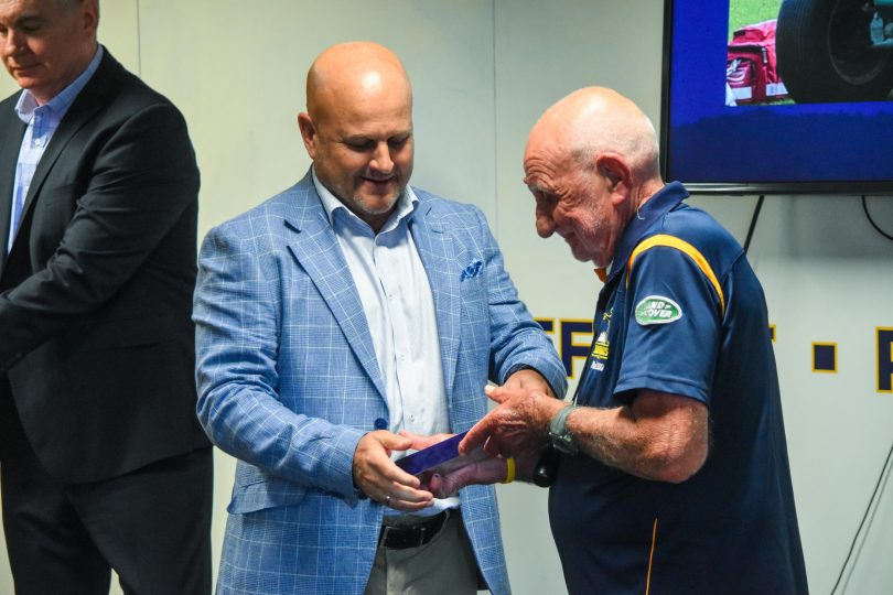 Rob Clarke presenting Garry Quinlivan with his award